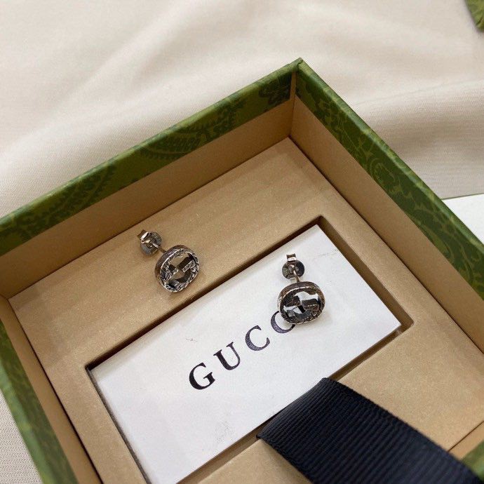 G*u*i earrings
